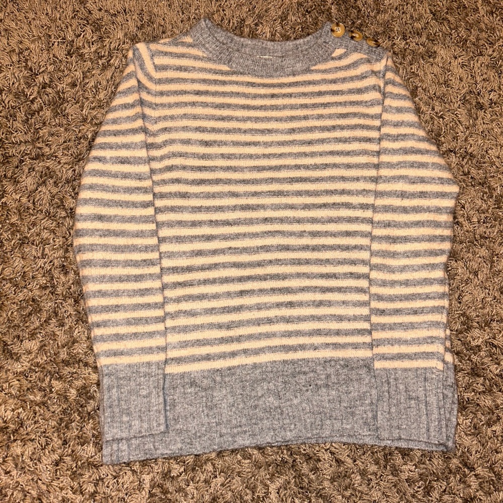 Striped grey and pink sweater with buttons on the left side